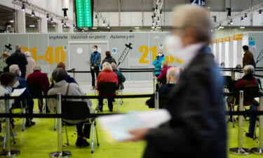 People wait to be vaccinated in Berlin