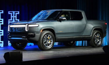 The Rivian R1T arrives on stage as a 2022 Truck of the Year Finalist at the LA Auto Show in Los Angeles