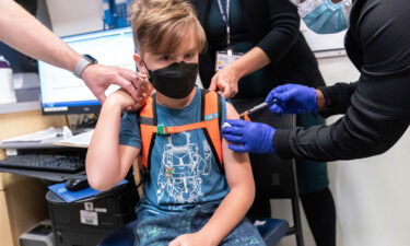 A nurse inoculates an 8-year-old child at NYC Health + Hospitals Harlem Hospital on November 4