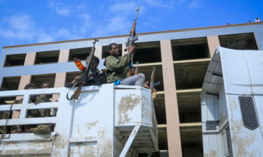 Tigrayan forces parade captured Ethiopian government soldiers and allied militia members in open-top trucks