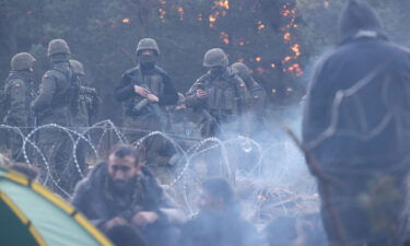 Migrants are seen waiting on the Belarusian side of the border on November 10. Thousands of migrants are facing desperate conditions as they try to cross into the EU.