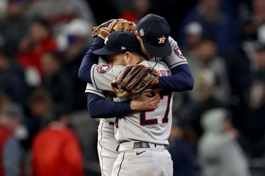 Carlos Correa and Jose Altuve of the Houston Astros celebrate the team's 9-5 win against the Atlanta Braves in Game 5.