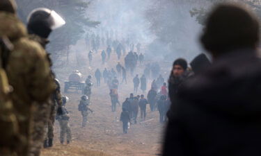 A picture taken on November 12 shows migrants in a camp on the Belarusian-Polish border in the Grodno region.