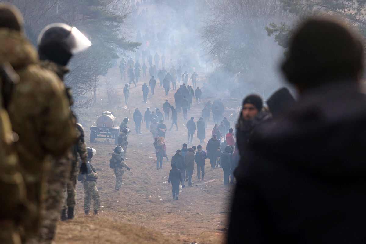 <i>Ramil Nasibulin/Belta/AFP/Getty Images</i><br/>A picture taken on November 12 shows migrants in a camp on the Belarusian-Polish border in the Grodno region.