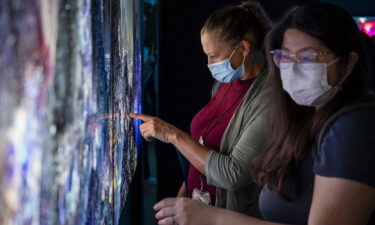 Visitors at an NFT art fair in Hong Kong in October.