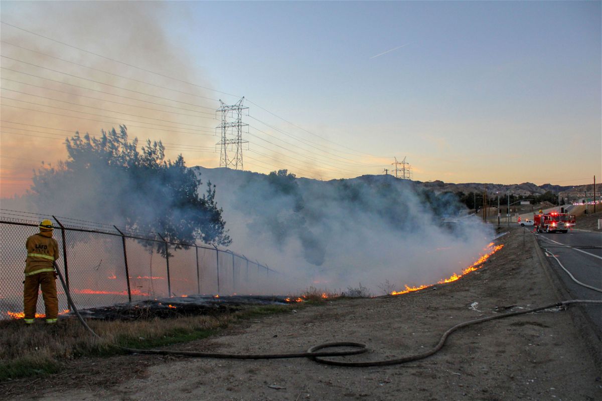 <i>Flickr/Los Angeles Fire Department</i><br/>Firefighters contain a two-acre brush fire in Los Angeles on November 25.