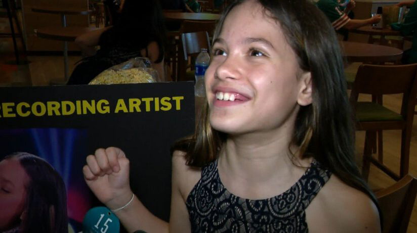 <i>WFOR</i><br/>10-year-old Isabella Velasquez smiles as she talks about her rendition of the national anthem before the December 19 National Football League game between the New York Jets and Miami Dolphins at Miami's Hard Rock Stadium.