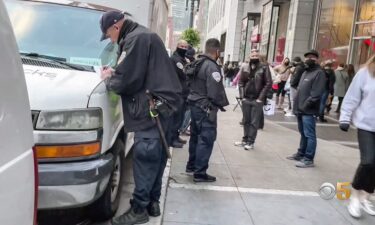 A San Francisco police officer writes a ticket after the city ordered a crackdown on unlicensed food vendors.