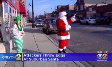 Adam White – dressed as Santa – is greeting shoppers and neighbors outside is brother’s store