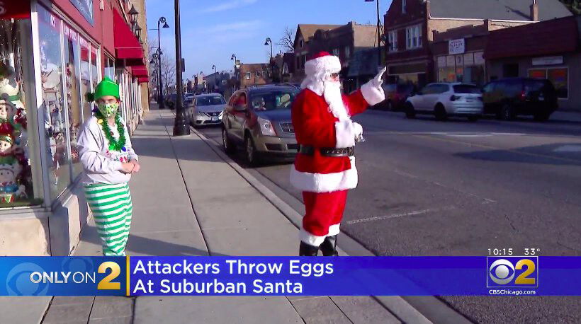 <i>WBBM</i><br/>Adam White – dressed as Santa – is greeting shoppers and neighbors outside is brother’s store