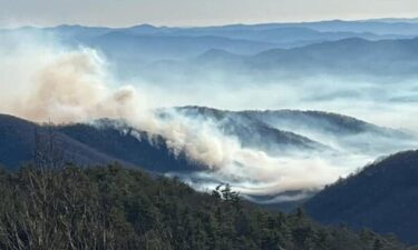 Firefighters and emergency personnel are monitoring a wildfire near Grandfather Mountain that was first reported on Christmas Eve.