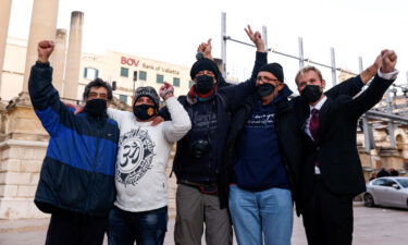 Supporters of the cannabis bill in Malta celebrate outside Parliament House in Valletta