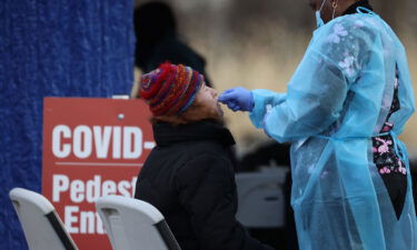 A woman getting a Covid-19 test at a drive through testing center in North Bergen of New Jersey