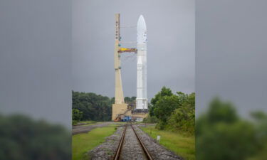 The Ariane 5 rocket and its cargo towers above the surroundings in French Guiana.