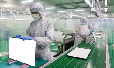 Activity at China's big factories continued to pick up this month even as the country battles stubborn Covid-19 outbreaks that threaten to hamper production.  Employees are shown here working on the production line of screen at a factory on December 29