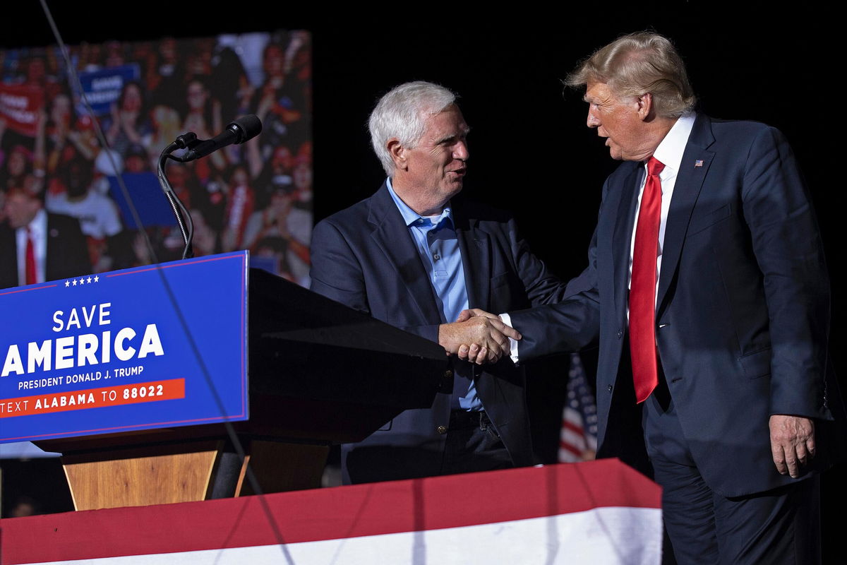 <i>Chip Somodevilla/Getty Images</i><br/>Former President Donald Trump welcomes candidate for Rep. Mo Brooks to the stage during a 