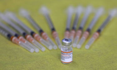 A picture shows a vial of the Pfizer/BioNTech Covid-19 vaccine during a vaccination drive at the al-Manahel School in the Druze village of Majdal Shams in the Israel-annexed Golan Heights.