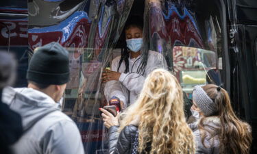 Some scientists think there is more evidence that Covid-19 is on its way to eventually becoming a seasonal endemic disease. A healthcare worker is shown here assisting residents at a Covid-19 test at mobile testing site near Rockerfeller Center in New York