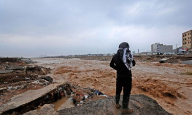 An Erbil resident takes a video of river water levels on the outskirts of the city.