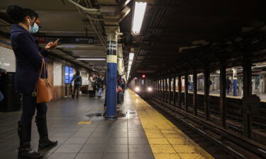 Commuters waiting on a subway platform in New York City on December 18