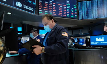 A trader works on the floor of the New York Stock Exchange at the start of trading on December 20 following a steep decline in global stocks over fears of the new Omicron COVID variant.