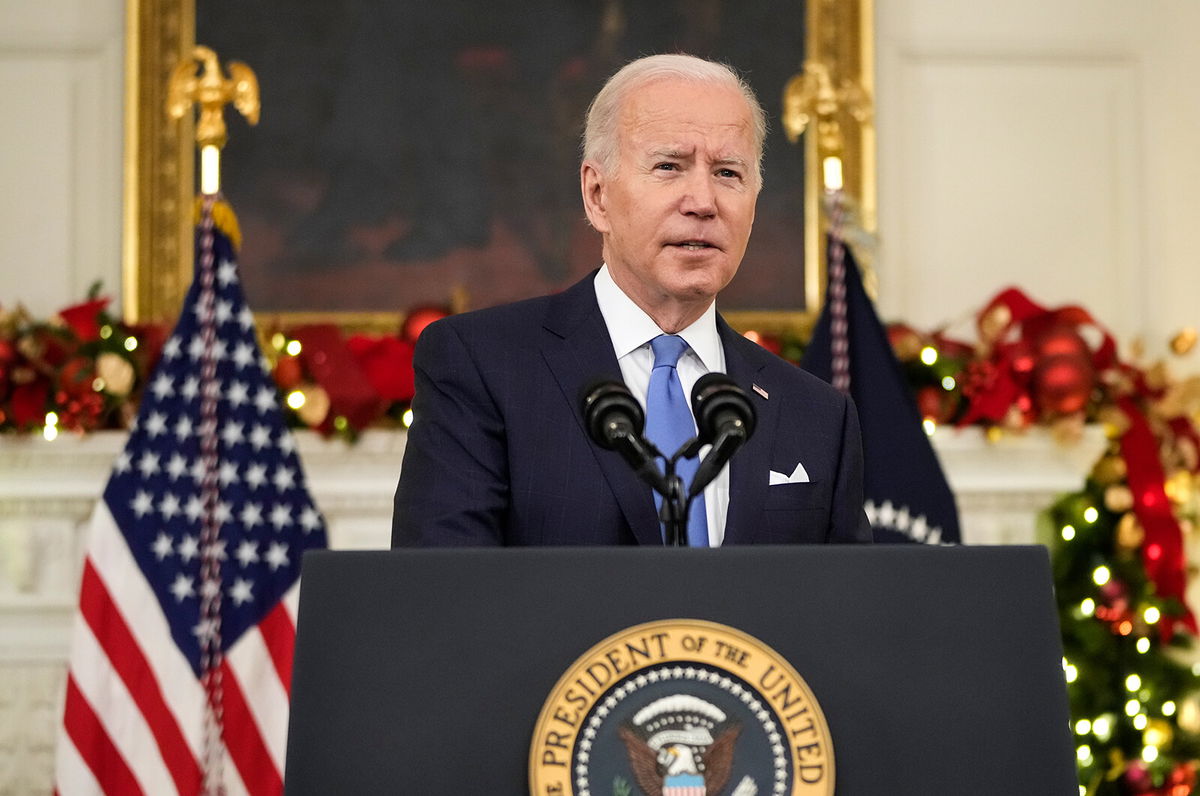 <i>Drew Angerer/Getty Images</i><br/>U.S. President Joe Biden speaks about the omicron variant of the coronavirus in the State Dining Room of the White House on December 21 in Washington