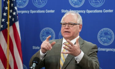 Minnesota Governor Tim Walz and family test positive for Covid. Walz is seen here at a news conference in May 2020.