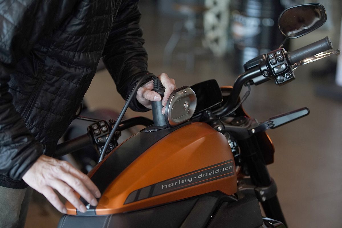 <i>George Frey/Bloomberg/Getty Images</i><br/>A charger is plugged into a LiveWire electric motorcycle at a Harley-Davidson showroom and repair shop in Lindon