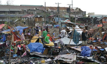 Residents salvage what's left of their damaged homes following Typhoon Rai in Cebu