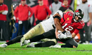 Brady is sacked by Marcus Davenport.