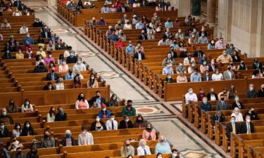 People attend Easter Sunday Mass while adhering to social distancing guidelines at the Basilica of the National Shrine of the Immaculate Conception in Washington