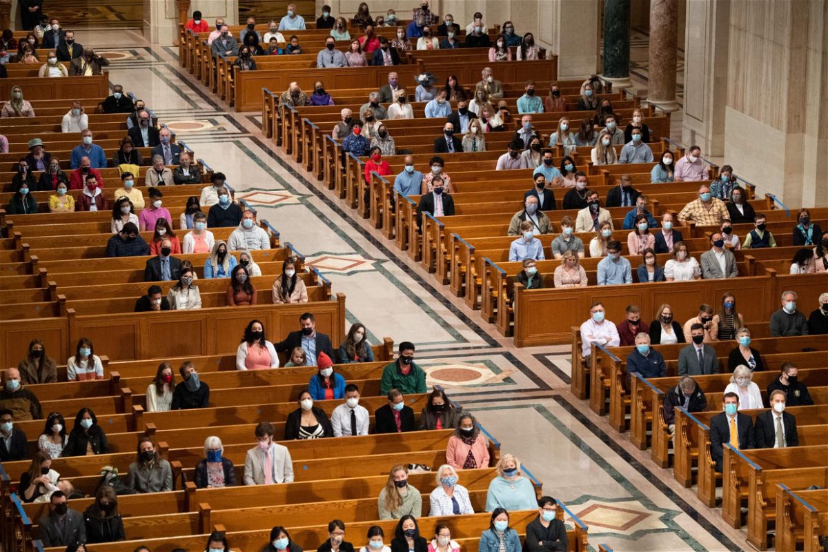 <i>Saul Loeb/AFP/Getty Images</i><br/>People attend Easter Sunday Mass while adhering to social distancing guidelines at the Basilica of the National Shrine of the Immaculate Conception in Washington