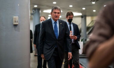 Sen. Joe Manchin leaves the Senate Chamber on Capitol Hill on December 15