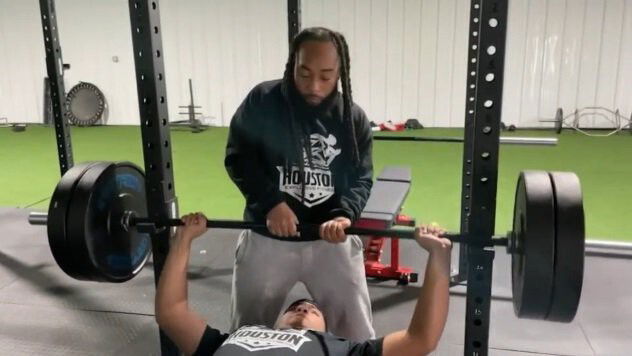 <i>KTRK</i><br/>Carlos Williams assists a weightlifter at the gym he co-owns in South Houston