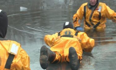 Members of the St. Louis Fire Department's ice rescue training team perform drills on January 23