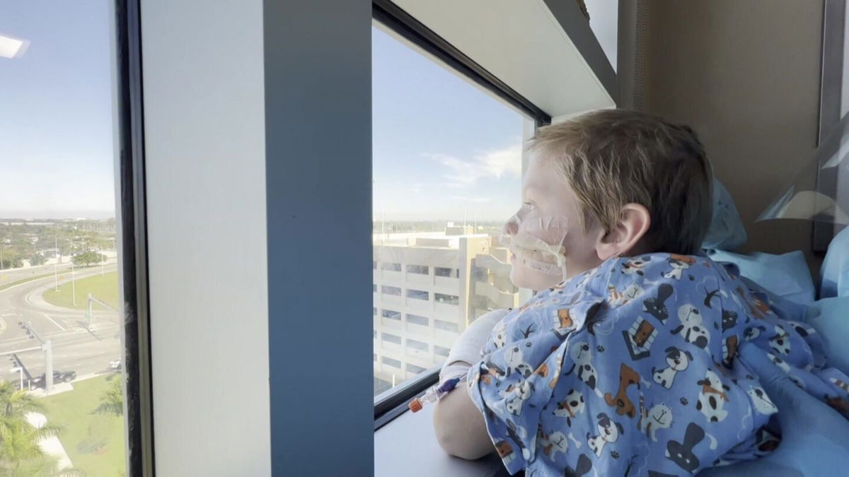 <i>WFOR</i><br/>Beau looking out the window seeing the outpouring of support from Miami-Dade police officers.