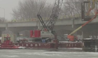 The crane was brought to the bridge by way of a barge that was assembled on the water