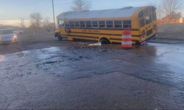 A Jackson school bus got stuck in a hole on the way to drop off a student at school.