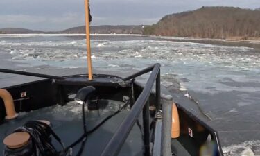 File - A Coast Guard on the Connecticut River in January 2018.