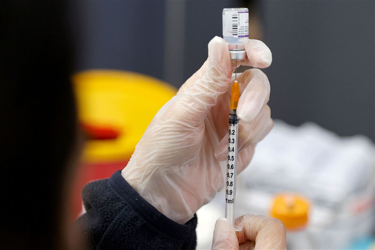 <i>Jack Guez/AFP/Getty Images</i><br/>A medic prepares a dose of the Pfizer-BioNTech vaccine against the coronavirus at a private nursing home in the Israeli central coastal city of Netanya on January 5