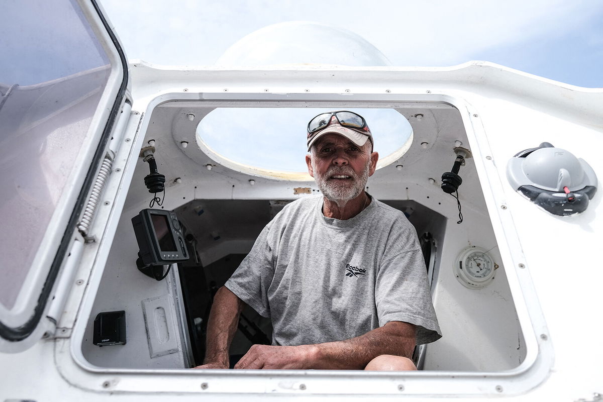 <i>Philippe Lopez/AFP/Getty Images</i><br/>Jean-Jacques Savin died attempting solo row across the Atlantic ocean. Savin here poses on his rowboat at a shipyard in Lege-Cap-Ferret