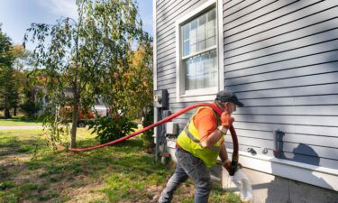 A man delivers oil to a home in Scarborough on Wednesday