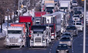 Vehicles from the protest are parked