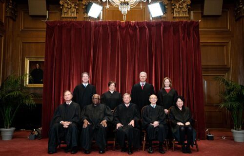 Members of the Supreme Court pose for a group photo at the Supreme Court in Washington