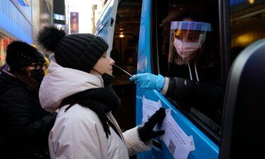 People get tested at a mobile Covid-19 testing van in Times Square on January 4