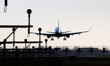 Dutch authorities discovered a stowaway hiding in the nose wheel of a cargo plane when it landed at Amsterdam's Schiphol Airport Sunday morning.