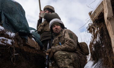 Ukrainian soldiers patrol on the frontline in Zolote