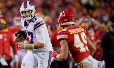 Buffalo Bills quarterback Josh Allen runs from Kansas City Chiefs safety Daniel Sorensen during the second half of an NFL divisional round playoff football game on January 23.