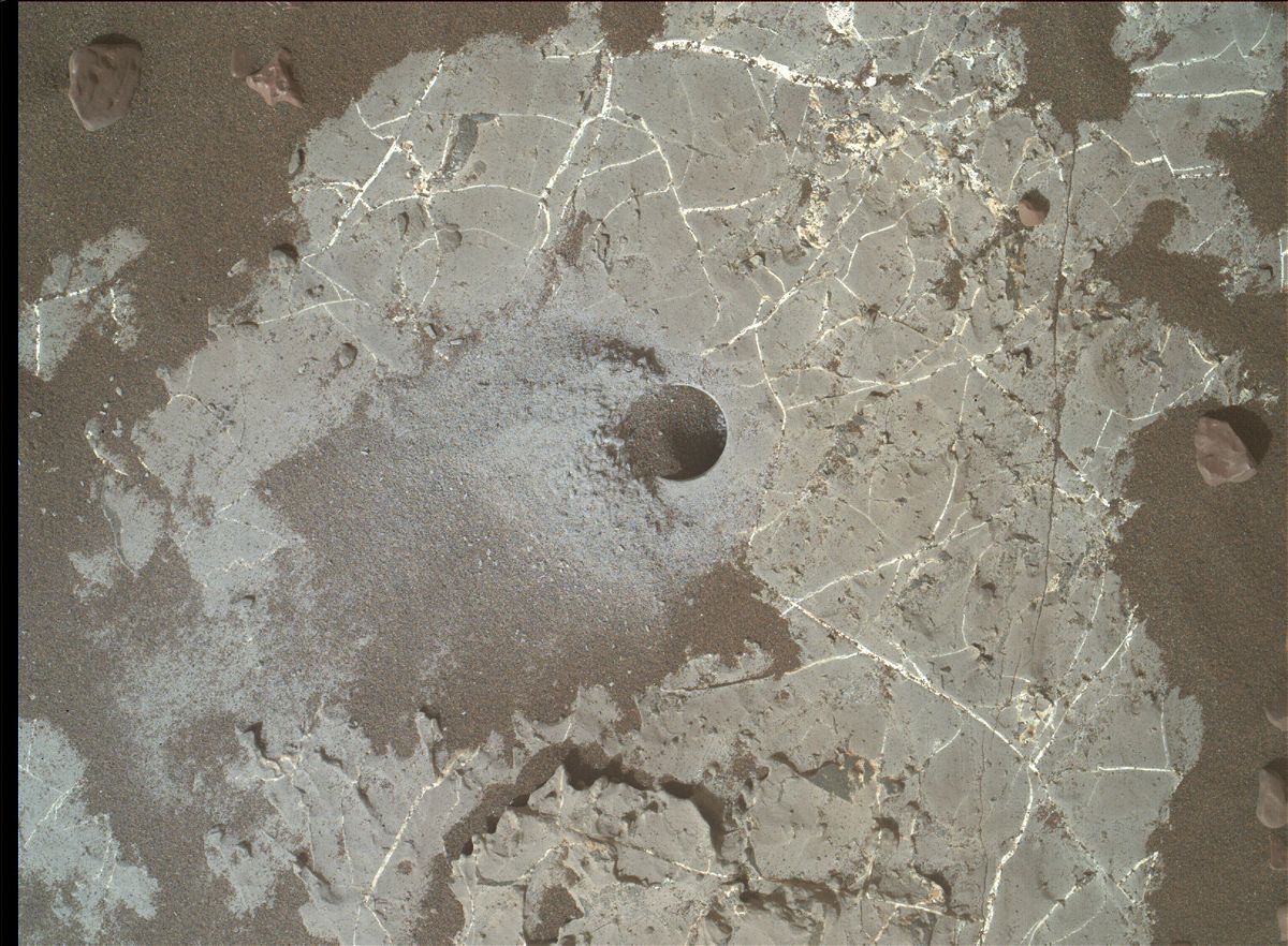 <i>NASA/Caltech-JPL/MSSS</i><br/>The image shows a drill hole made by Curiosity on Mars' Vera Rubin Ridge.