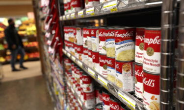 Grocery prices keep going up. Cans of Campbell's Soup are displayed on a shelf at Scotty's Market on December 08